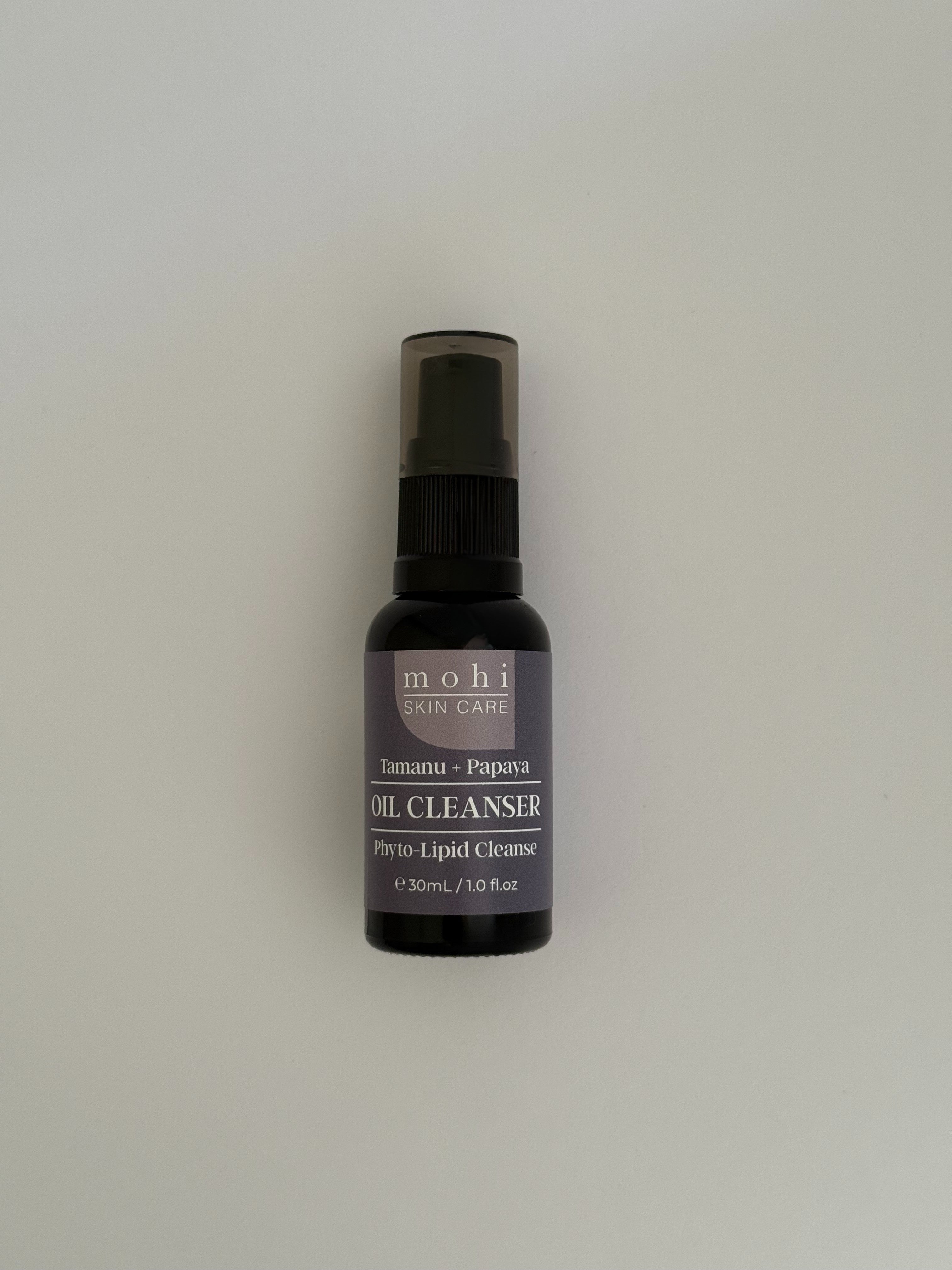 Bottle of mohi skin care oil cleanser on a white background